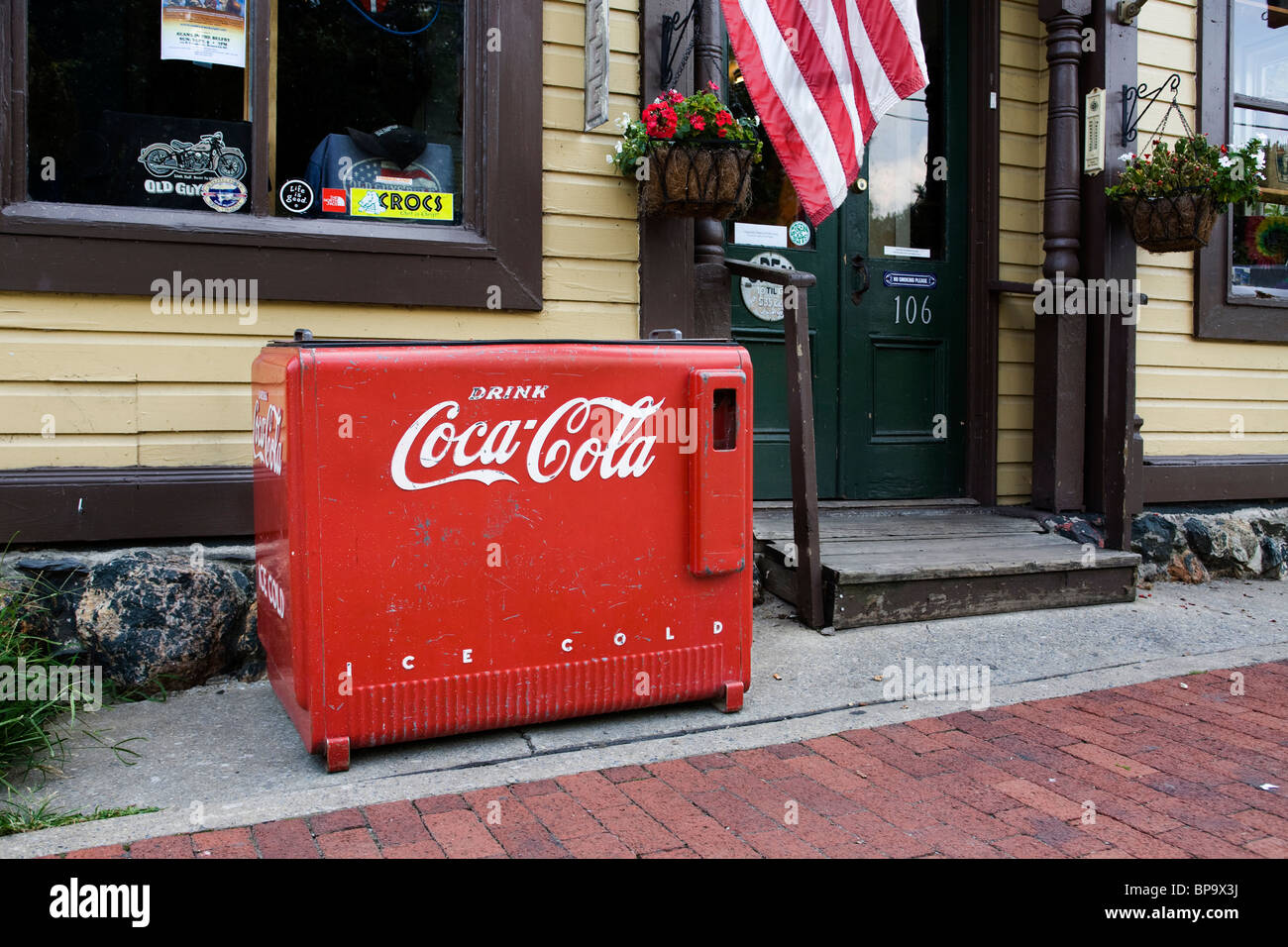 Antique Coca Cola cooler in front of country store - West Virginia, US Stock Photo