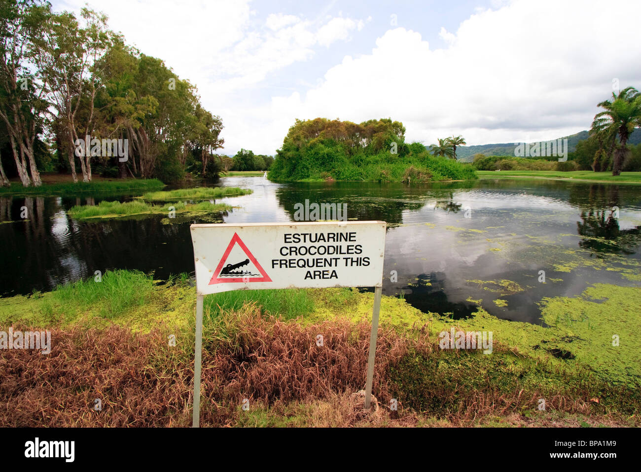 A crocodile warning sign on the Sheraton Mirage golf course, Port Douglas, far north Queensland, Australia Stock Photo