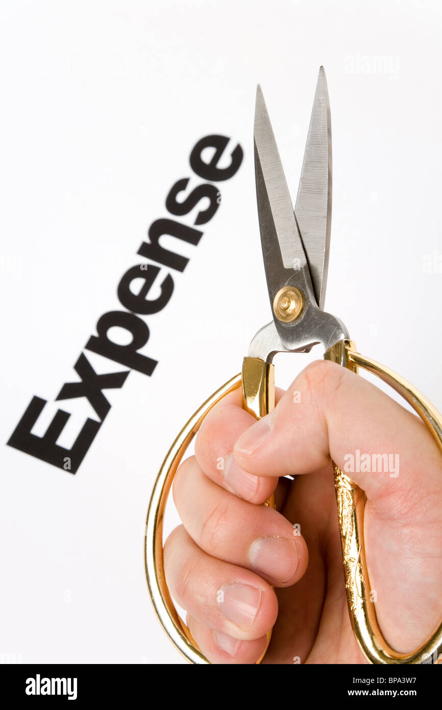 text of Expense and scissors, concept of Expense cut Stock Photo