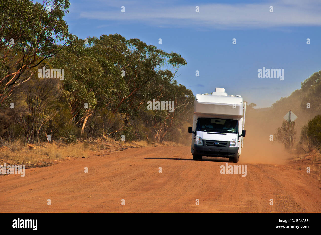 Motorhome on unsealed dusty outback road Western Australia Stock Photo