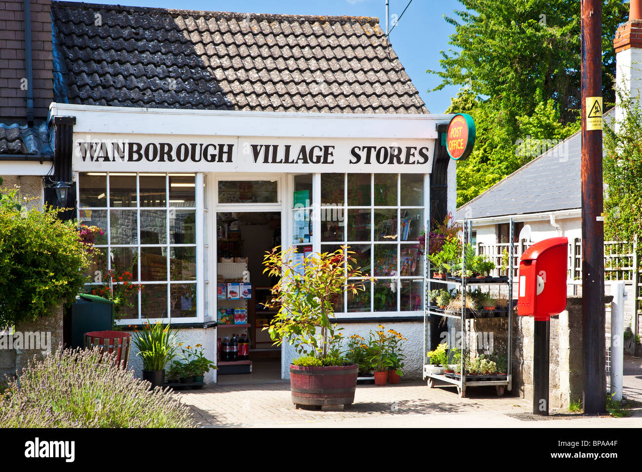 Typical English village grocer shop or store, newsagent and post office in Wanborough, Wiltshire, England, UK Stock Photo