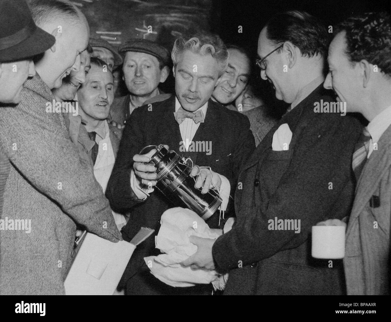 MARIUS GORING, ALEXANDER GALPERSON, FILM CREW PRESENT TANKARD, MR. PERRIN AND MR. TRAILL, 1948 Stock Photo
