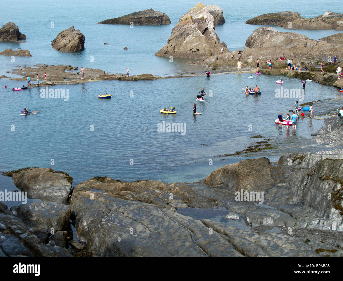 Children playing in the rock pool at the Tunnels Beaches in