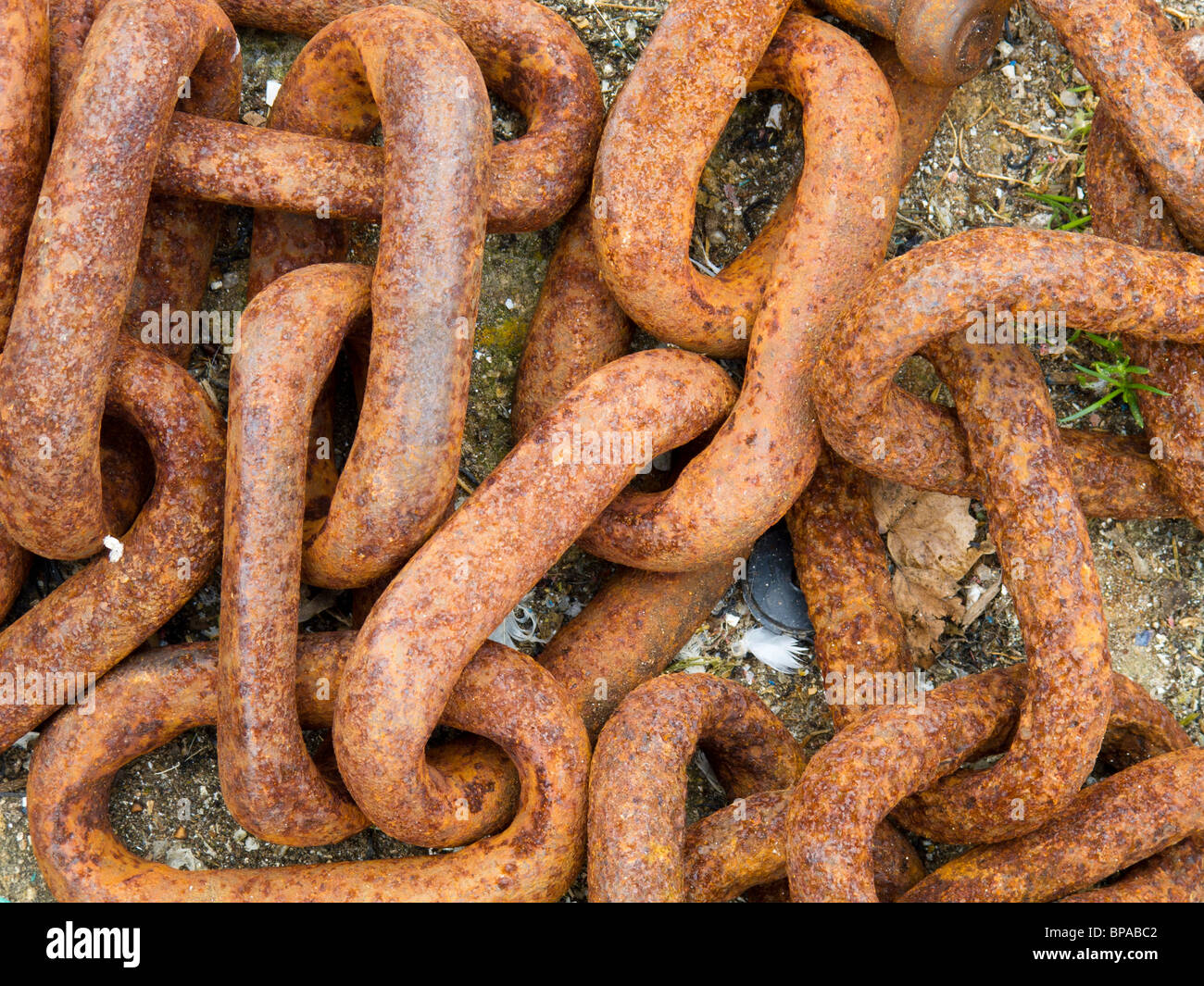 Rusted chain links on the quayside at Ilfracombe harbour in north Devon Stock Photo