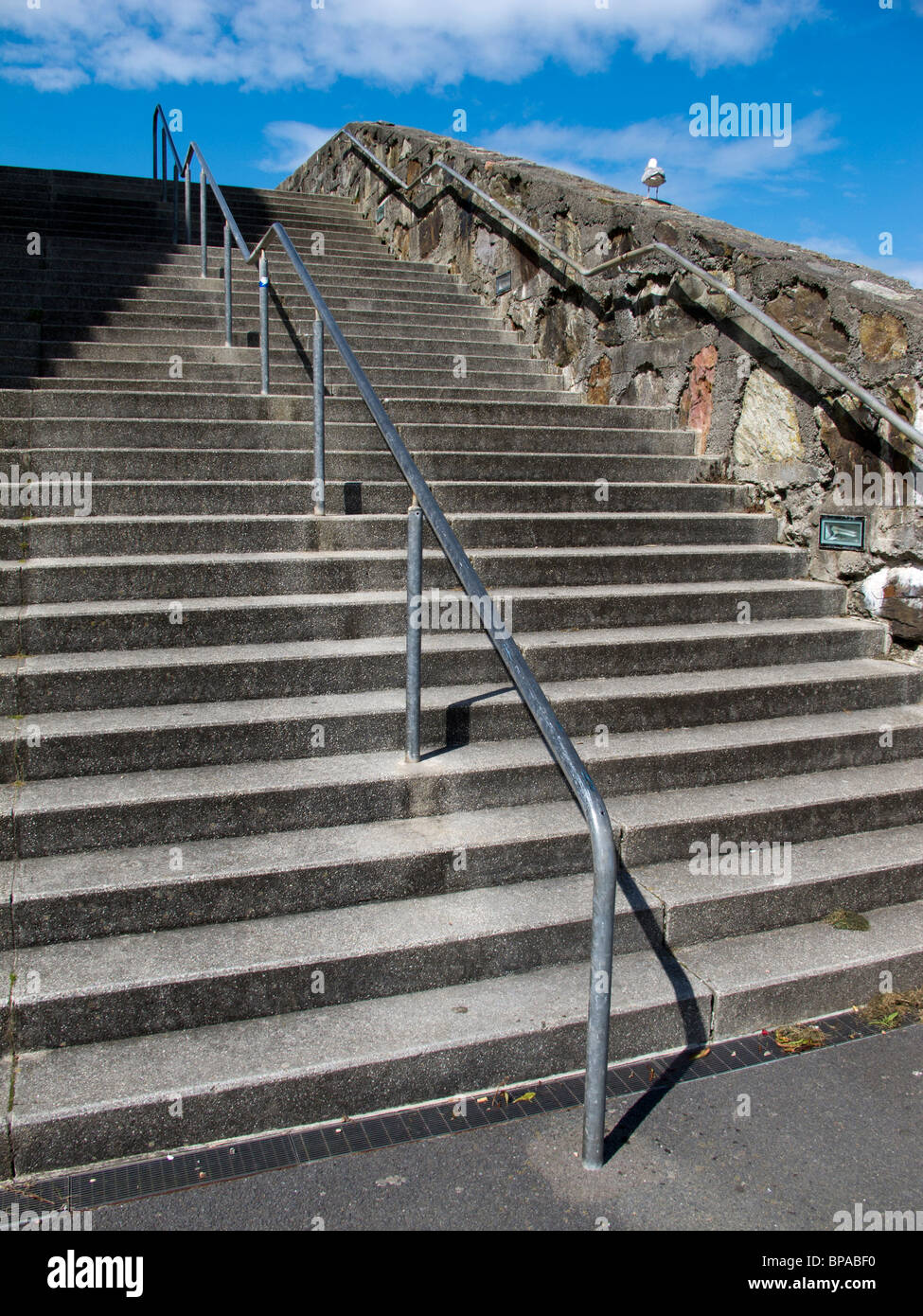 Steep stone steps with safety rails on the sea front at Ilfracombe in north Devon Stock Photo