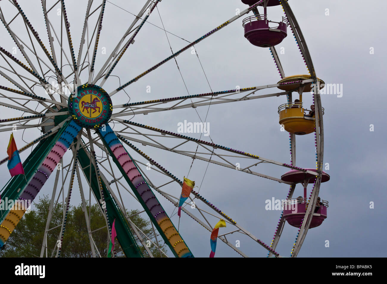 Close up of Ferris wheel with the people sky horizontal low angle