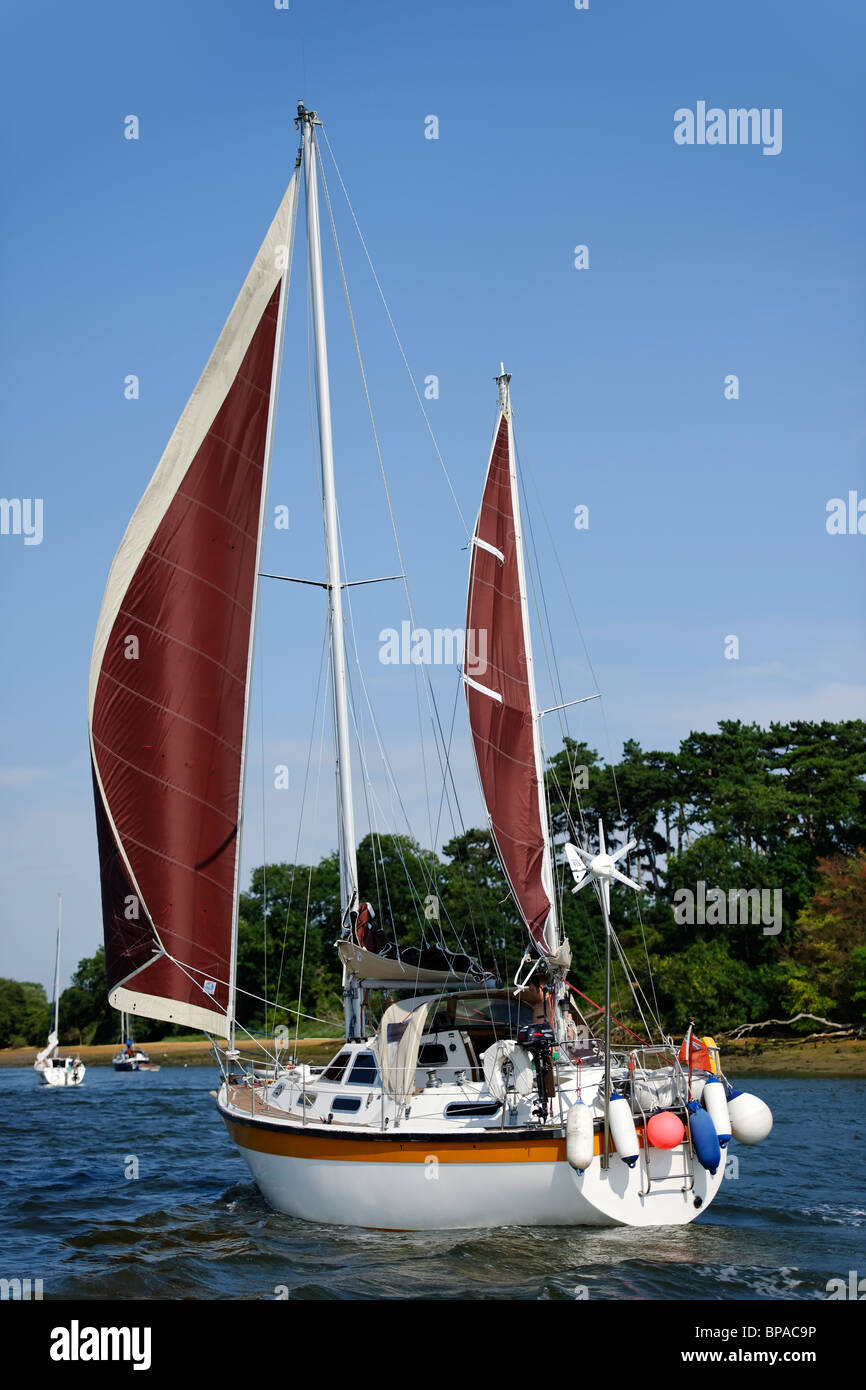 Sailing boat on the estuary Stock Photo