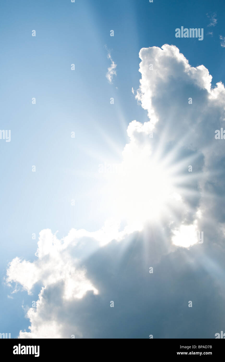 Sunburst through clouds Stock Photo