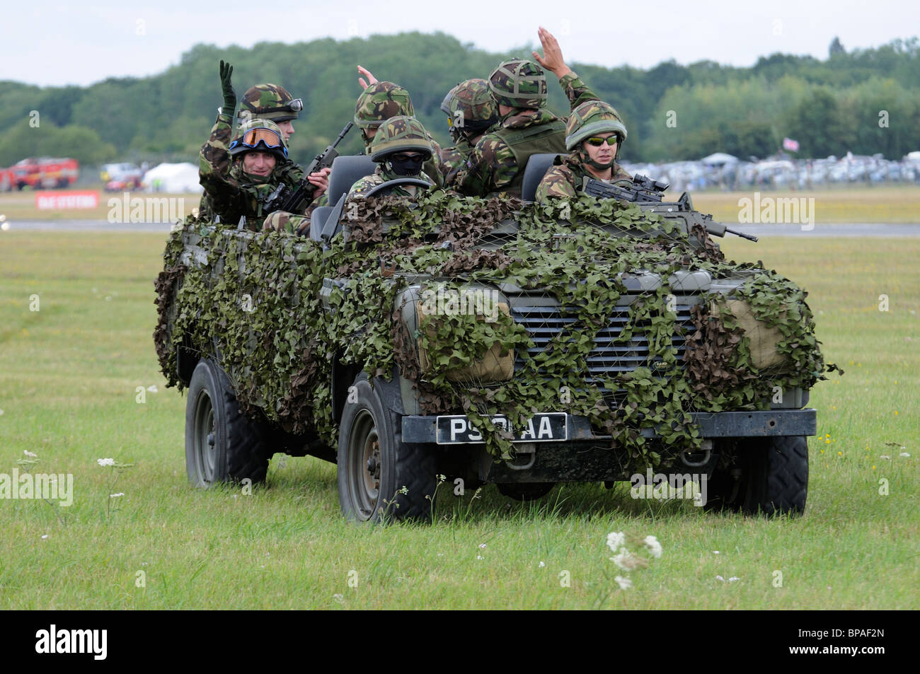British soldiers in their camouflaged Land Rover leave the display area at  the 2010 RIAT Royal International Air Tattoo Stock Photo - Alamy