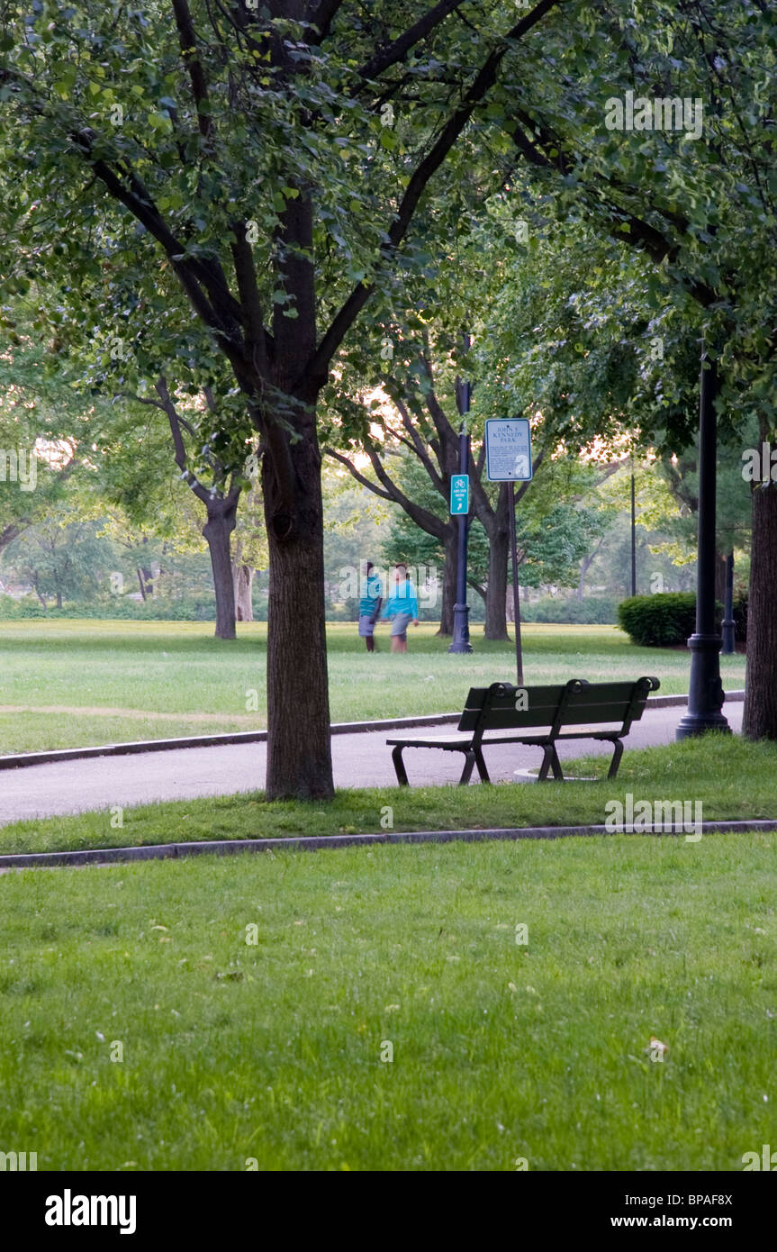 a bench in John Fitzgerarld Kennedy Park in Harvard, Cambridge, Massachusetts Stock Photo