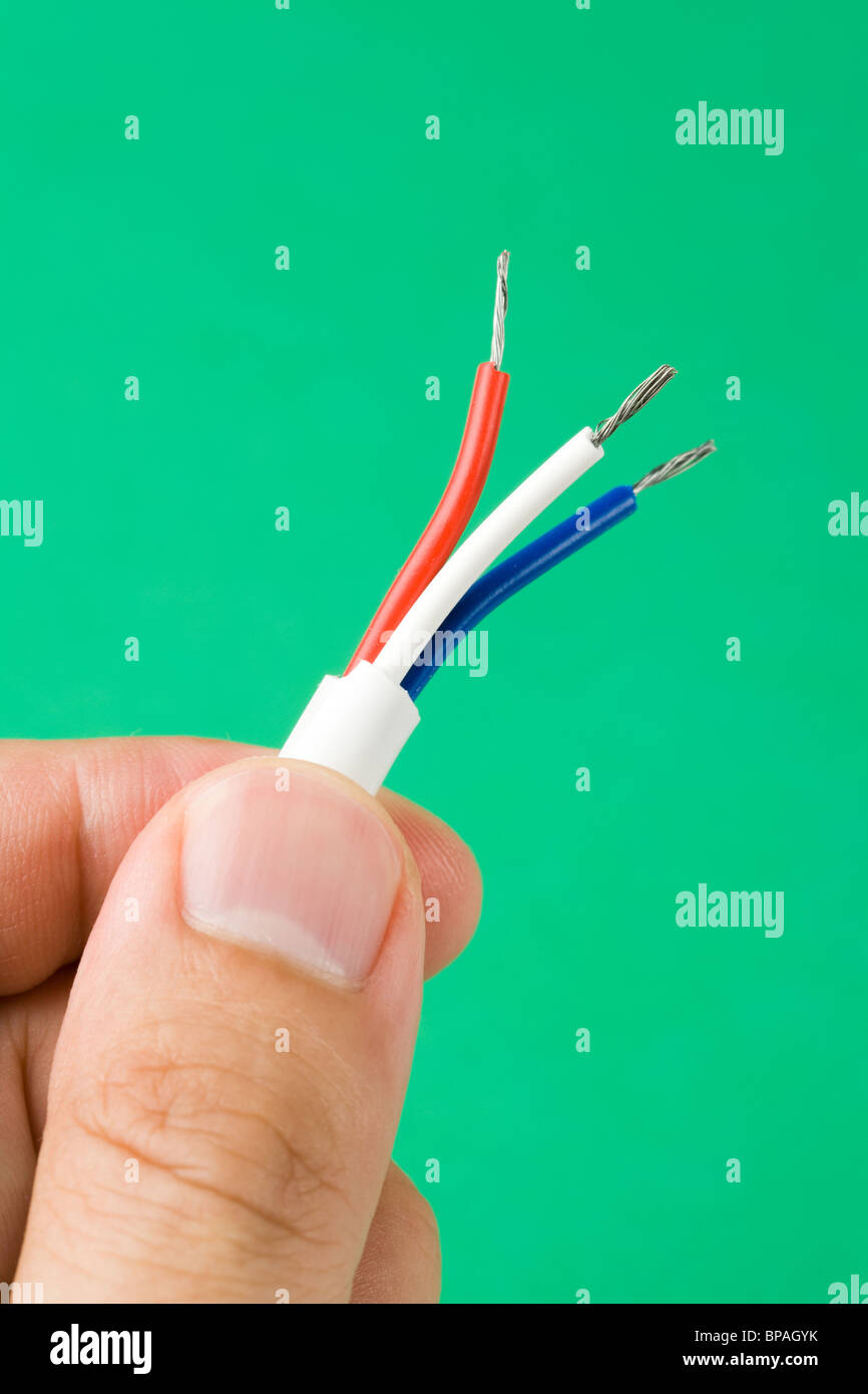 Electrical wire with green background Stock Photo - Alamy