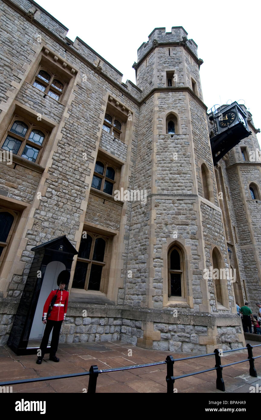Soldier in bearskin by his sentry box outside Waterloo BLock which houses the Crown Jewels at the Tower of London. Stock Photo