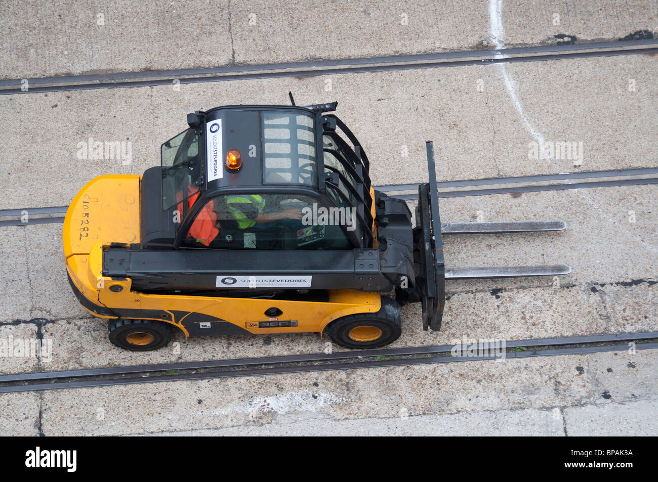 A fork lift truck preparing to move boxes of food or drink in Southampton, England. Stock Photo