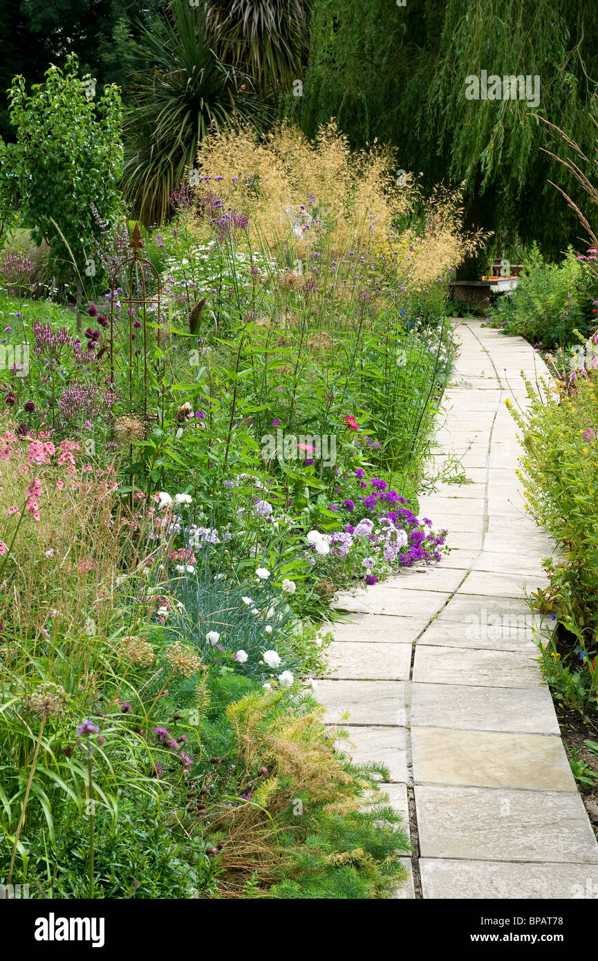 garden path and flower border Stock Photo
