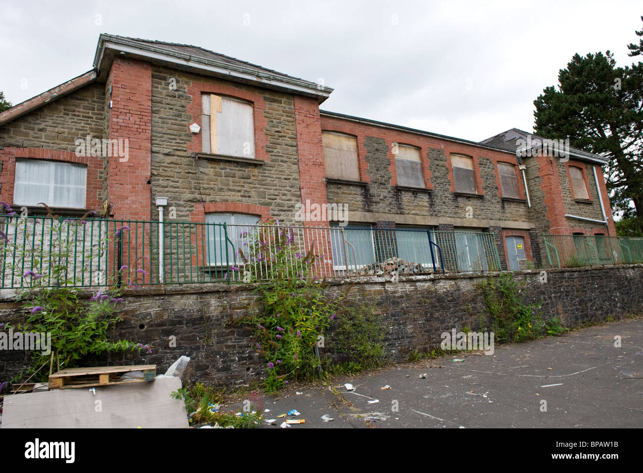 Closed empty derelict boarded up and for sale former