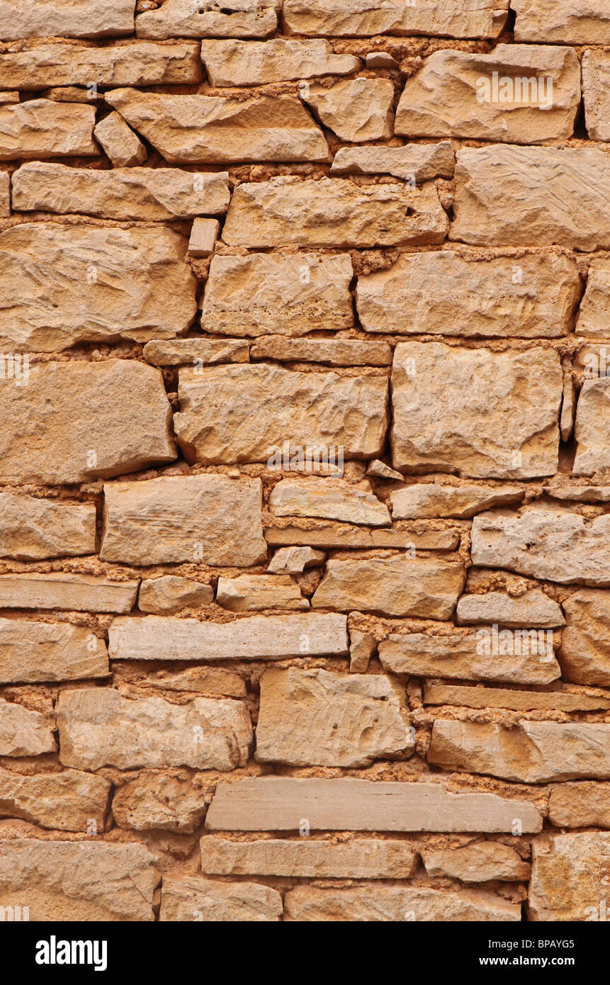 Majorca Mallorca yellow sandstone stone house wall Stock Photo