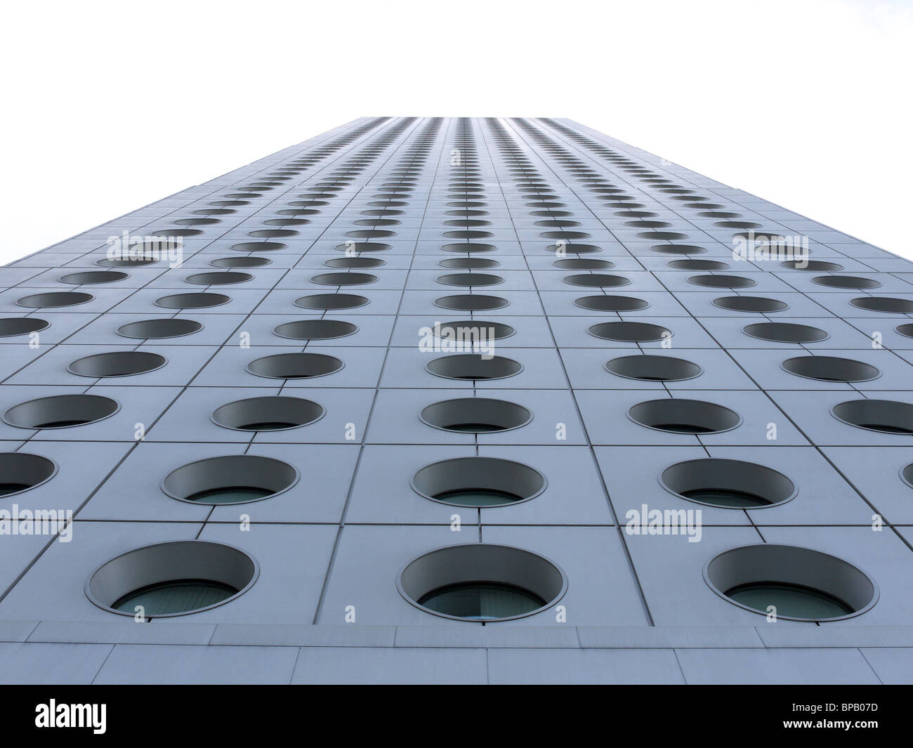 Vertical view looking up at the distinctive round windows of Jardine