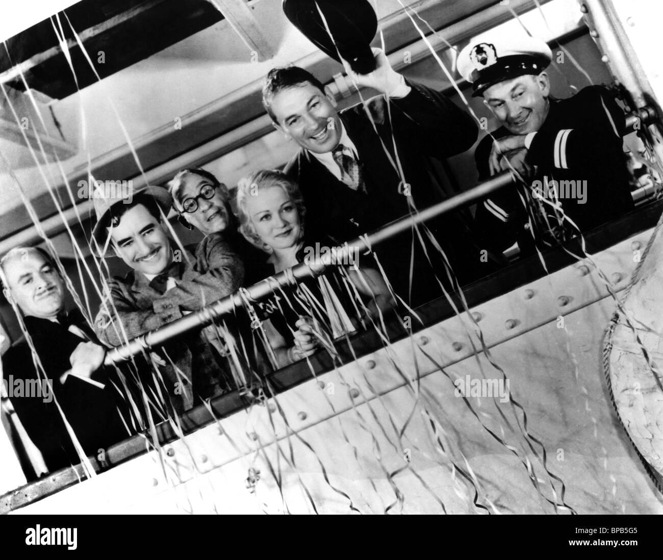 CLAUDE GILLINGWATER, JOHN GILBERT, WYNNE GIBSON, VICTOR MSLAGLEN, LEON ERROL, THE CAPTAIN HATES THE SEA, 1934 Stock Photo