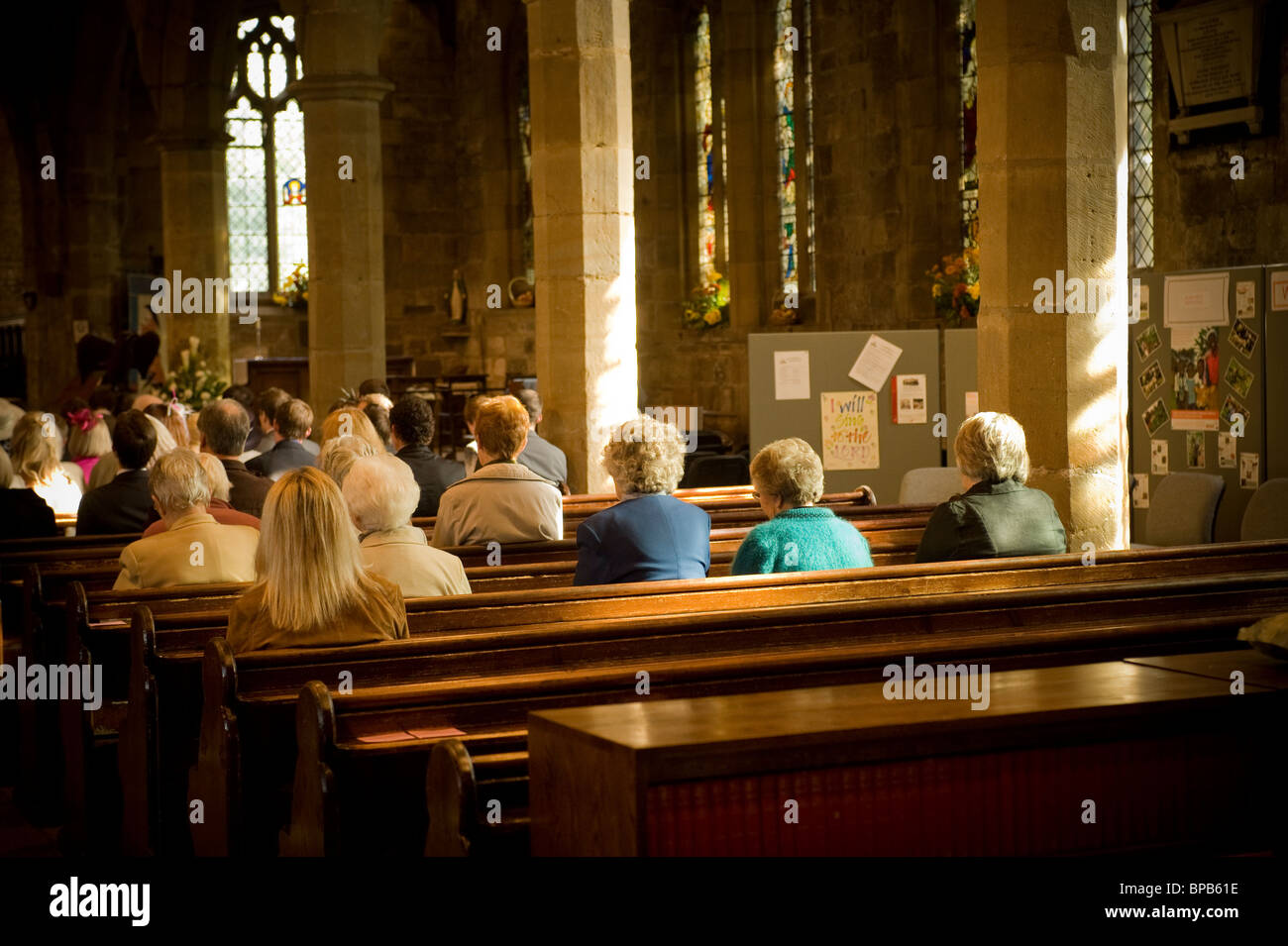 Rear view of seated congregation in UK church. Stock Photo