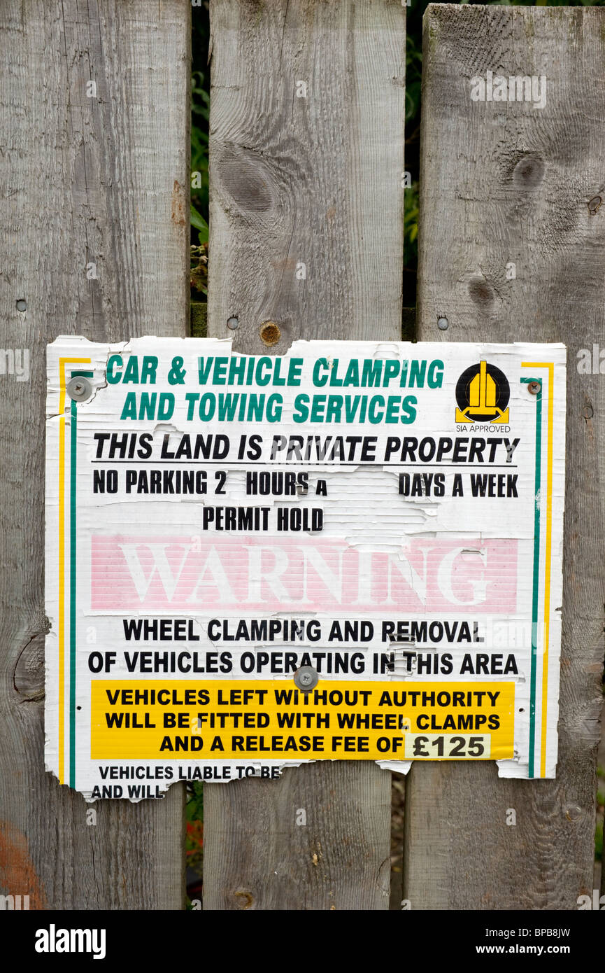 Car and vehicle clamping and towing notice in private property on a