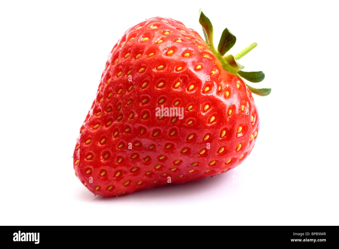 A strawberry close up on a white background Stock Photo - Alamy