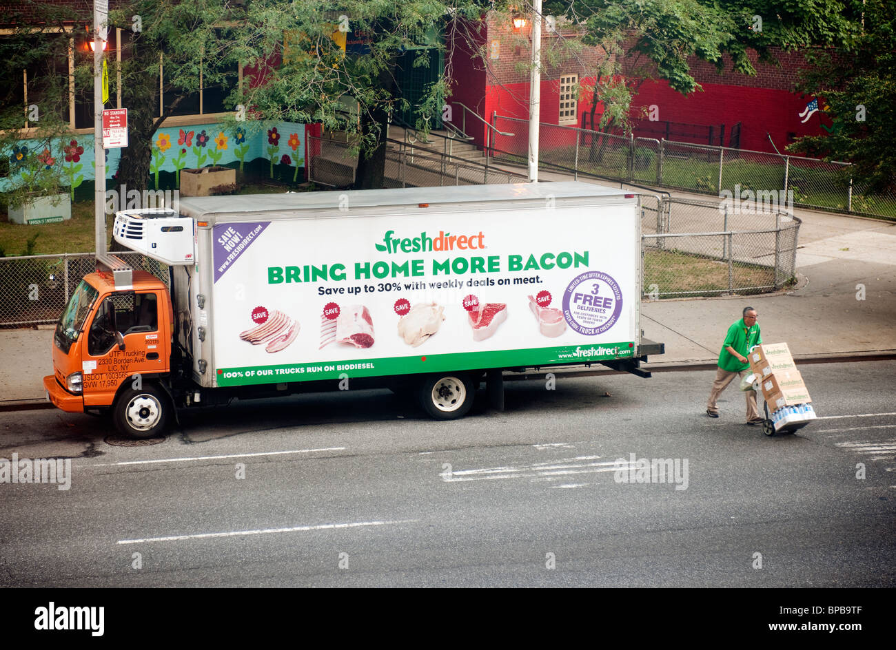 A Fresh Direct truck makes a delivery in Chelsea neighborhood of New