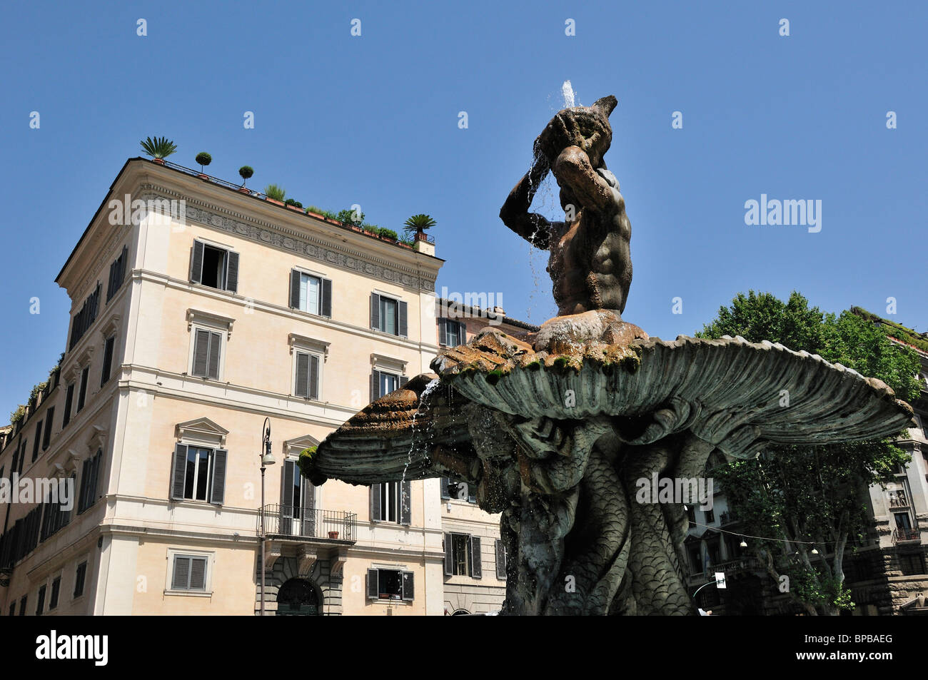 Fountain of Triton (Fontana del Tritone) baroque fountain by Gian Lorenzo Bernini on Piazza Barberini Rome Italy Stock Photo
