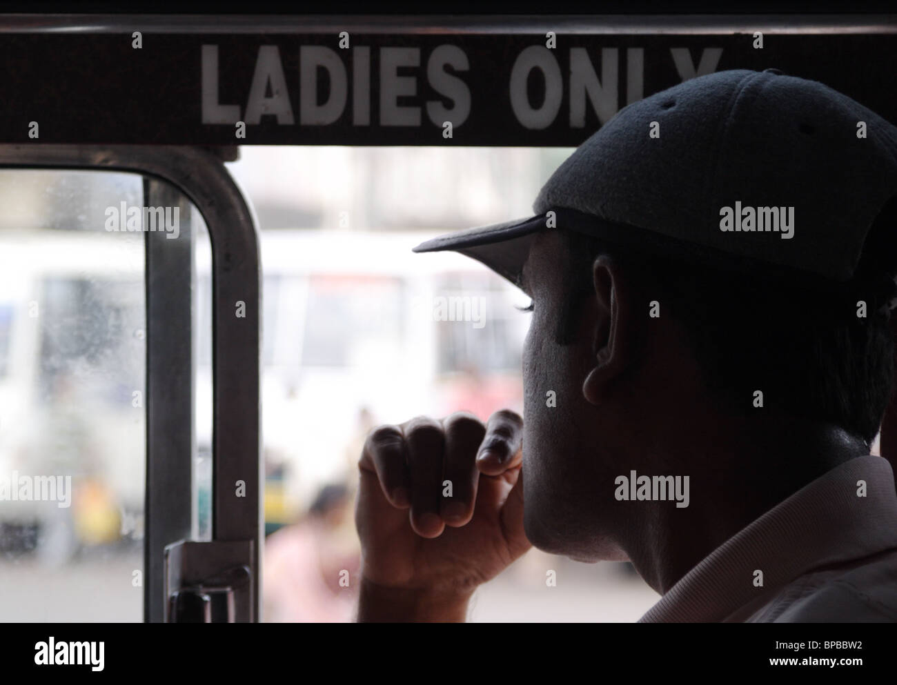 man on ladies seat Stock Photo