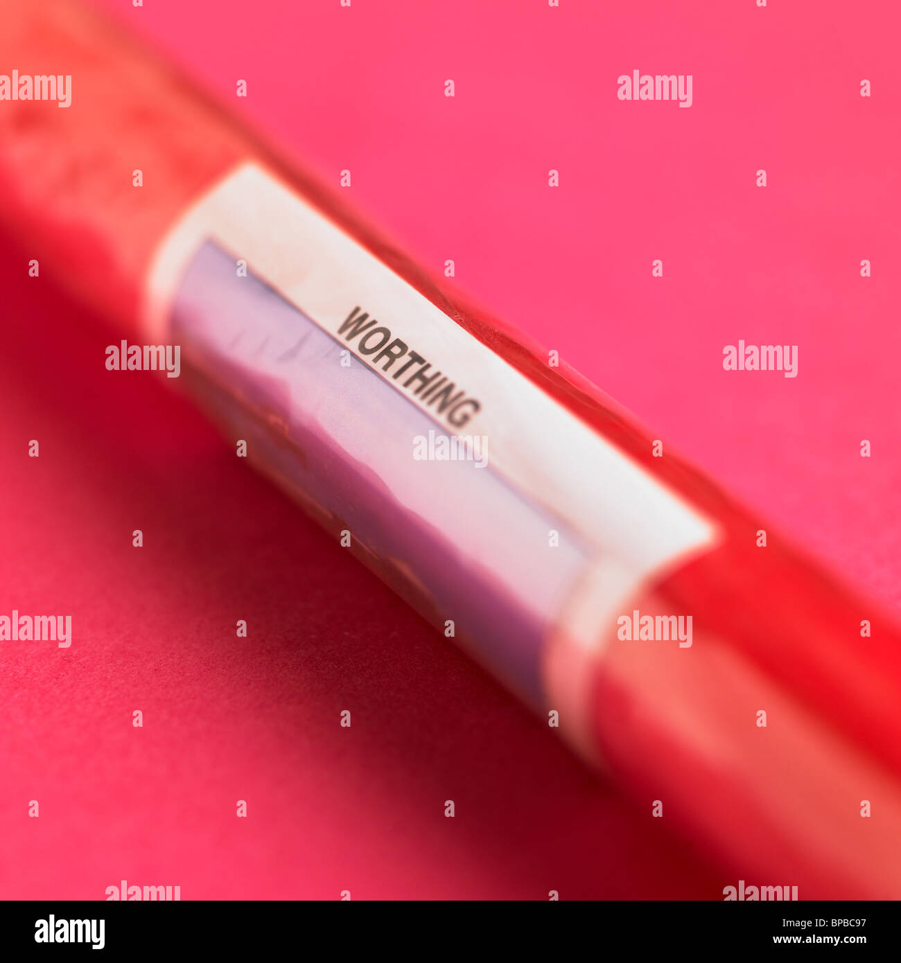 Stick Of Seaside Rock On Pink Background Stock Photo Alamy