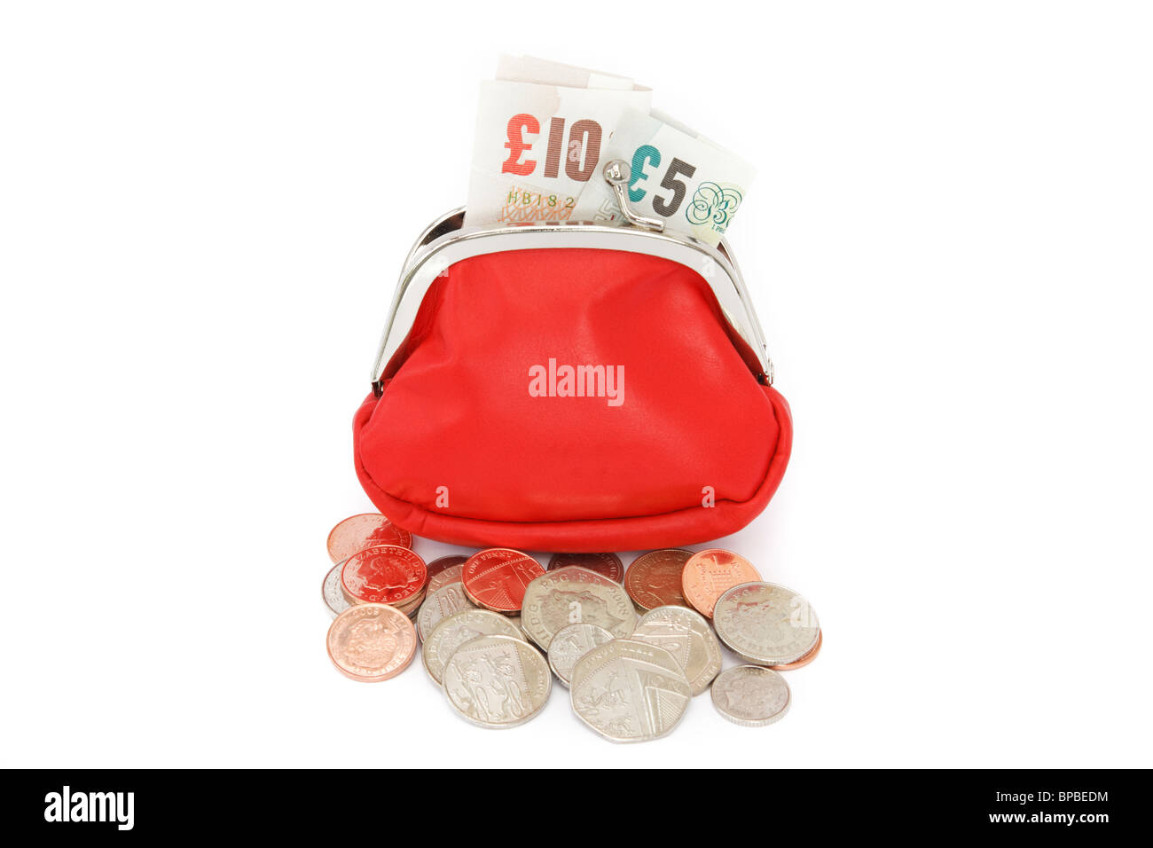 Open red money purse containing ten and five pound notes with some coins spilling out isolated on a plain white background. England, UK, Britain Stock Photo