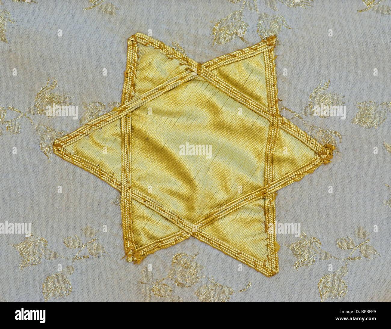 Vintage tapestry with Star of David in gold Stock Photo