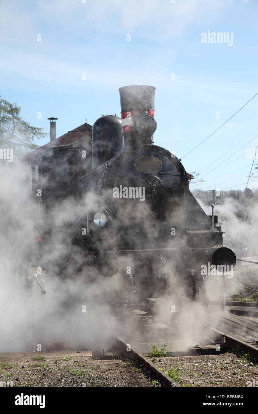 Preserved steam locomotive starting up in Rungsted, Denmark. Built for the Danish Railways by Societa Italiana Ernesto Breda in Italy in the year 1900 Stock Photo