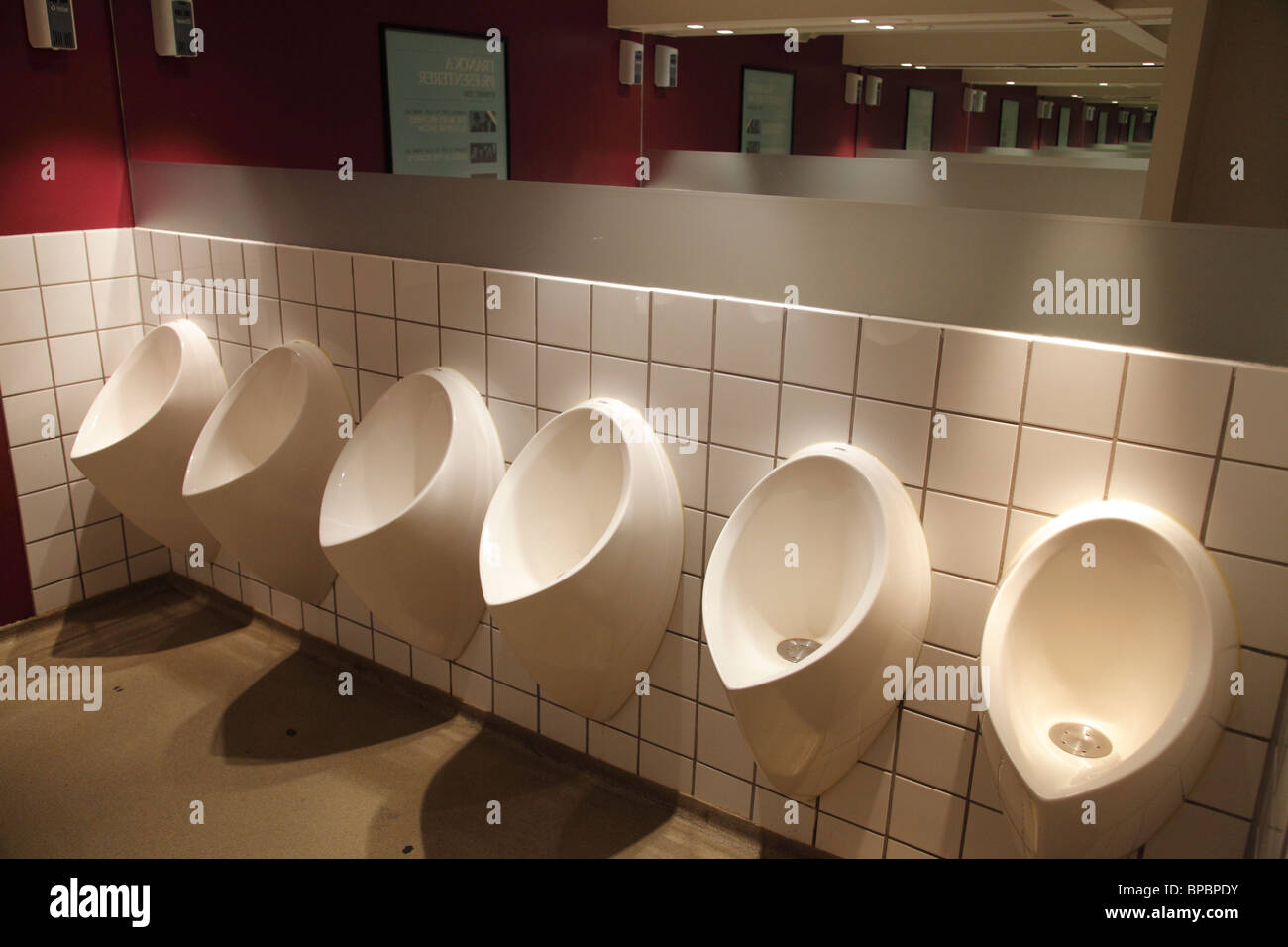 urinals in a public toilet Stock Photo