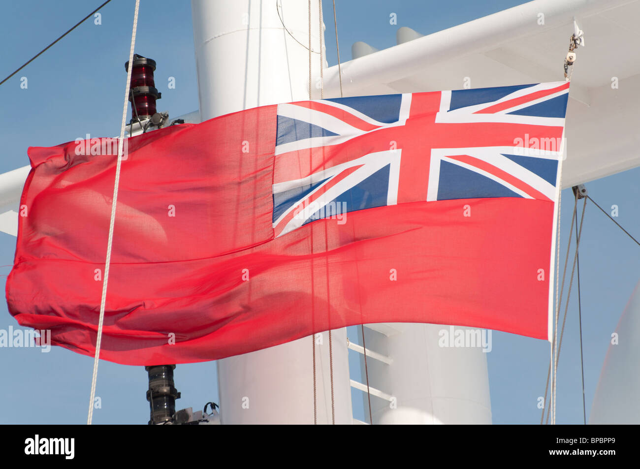 The Red Ensign flag which is used for civilian ships visiting UK waters. Stock Photo