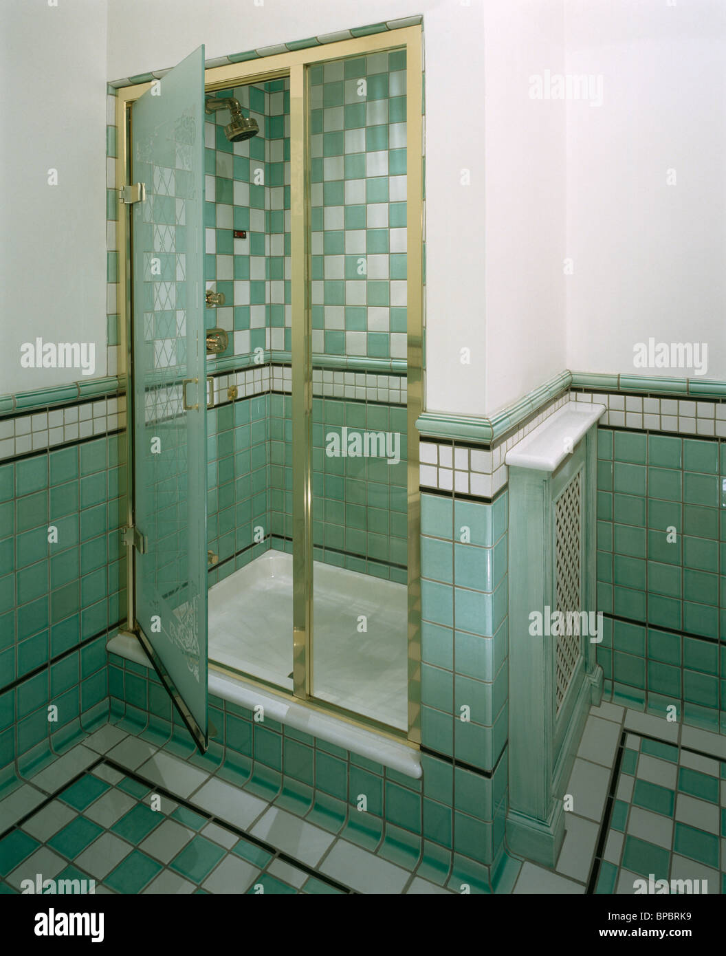 Glass Doors On Shower Cabinet With Green White Tiled Walls In White Bathroom With Green Wall Tiles Stock Photo Alamy