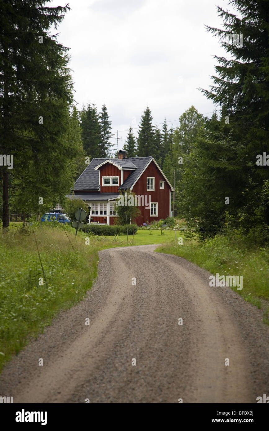 Red painted Swedish house with road, leading to the house, Torsby, Värmland, Sweden Stock Photo