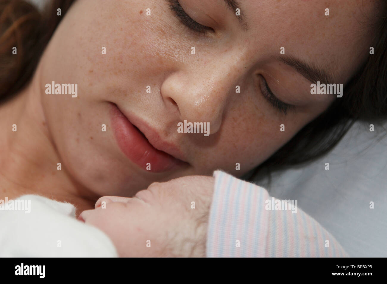 Newborn Infant and Mother Stock Photo