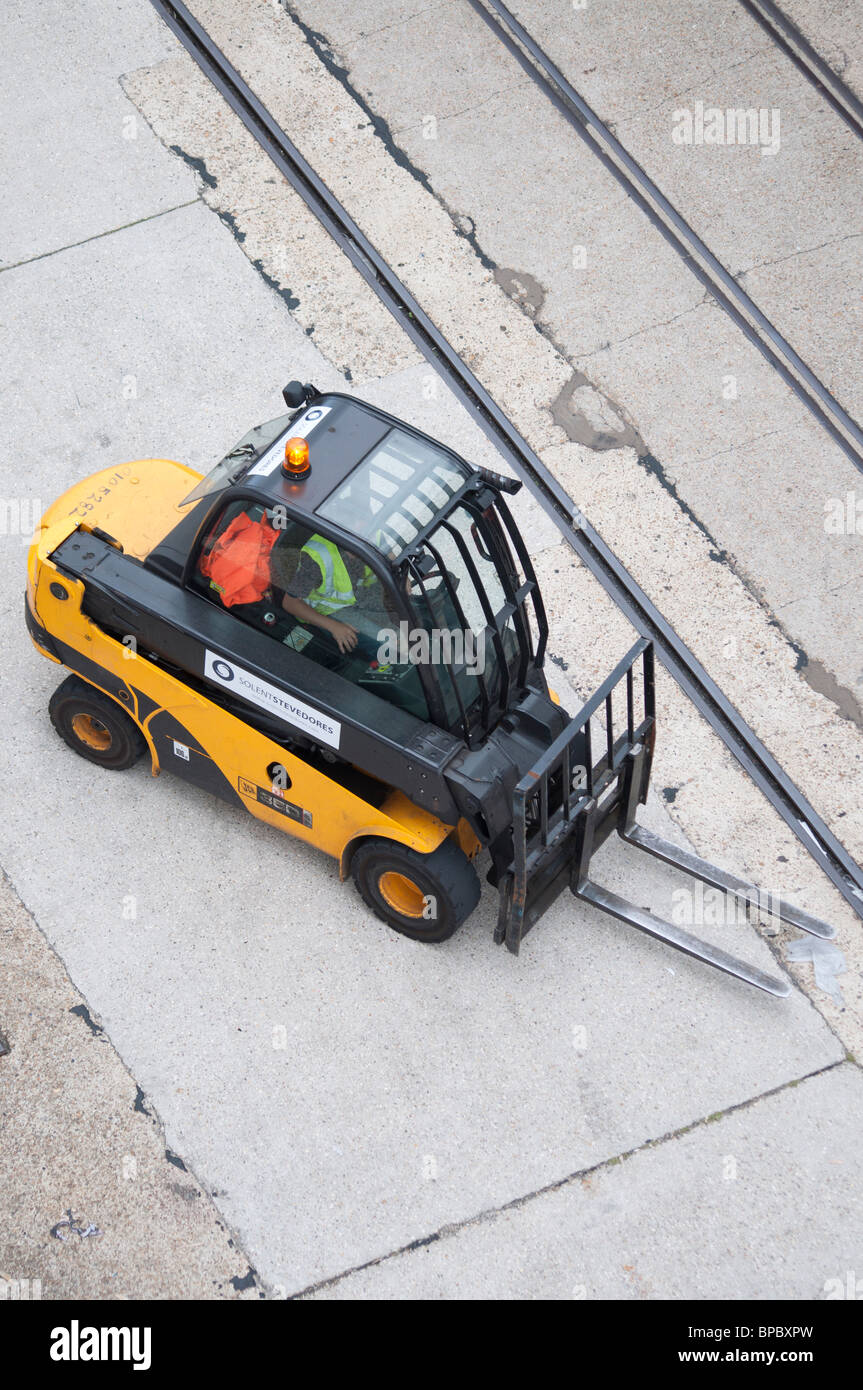 A fork lift truck preparing to move boxes of food or drink in Southampton, England. Stock Photo