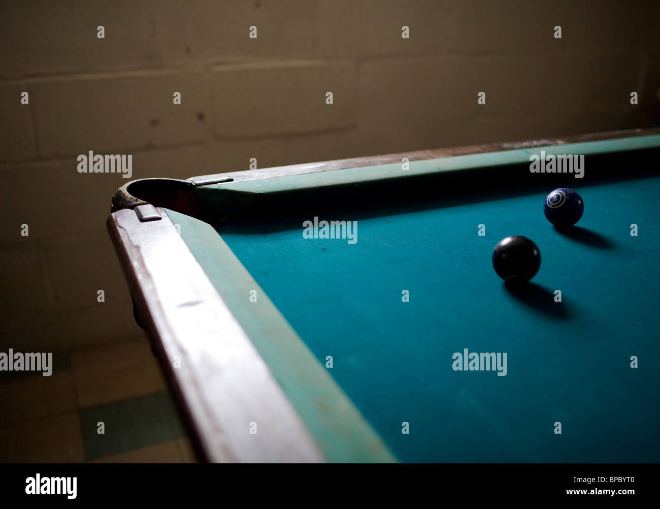 Pool balls on a dark pool table Stock Photo