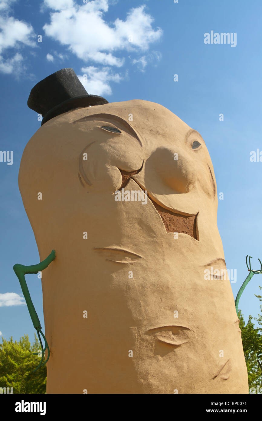 A cement statue of a giant potato man stands beside the the road on the old trans Canada highway out of Frederiction, NB, Canada Stock Photo