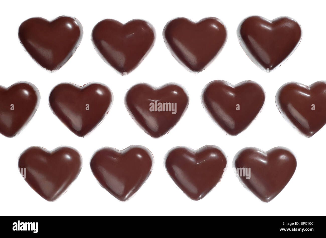 Heart-shaped dark chocolate candies Stock Photo