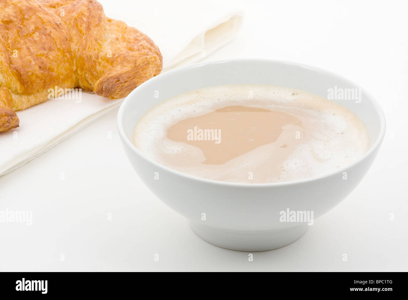 Cafe au lait with butter croissant over white background Stock Photo