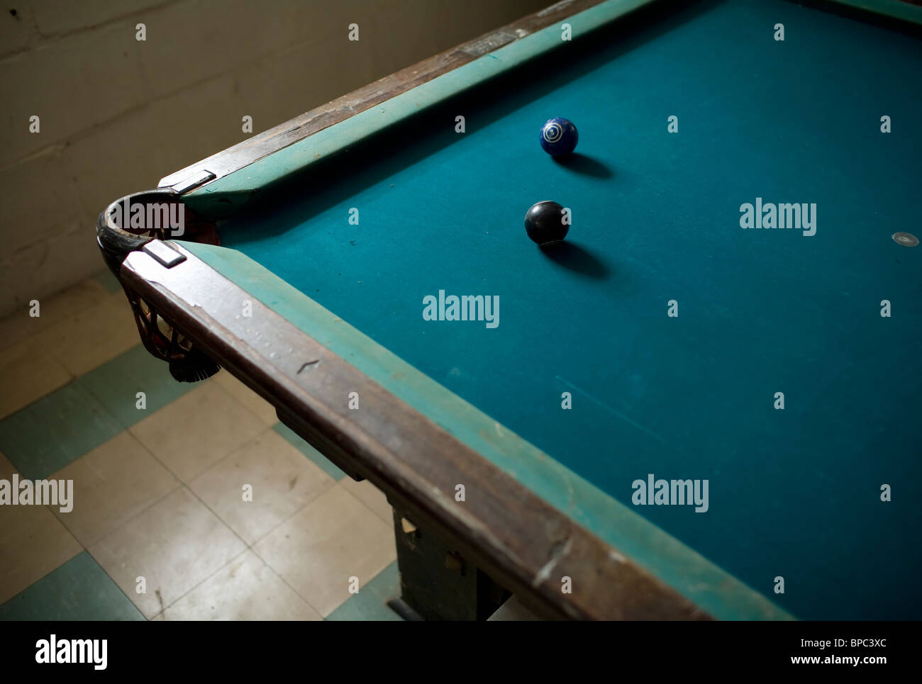 Pool balls on a dark pool table Stock Photo