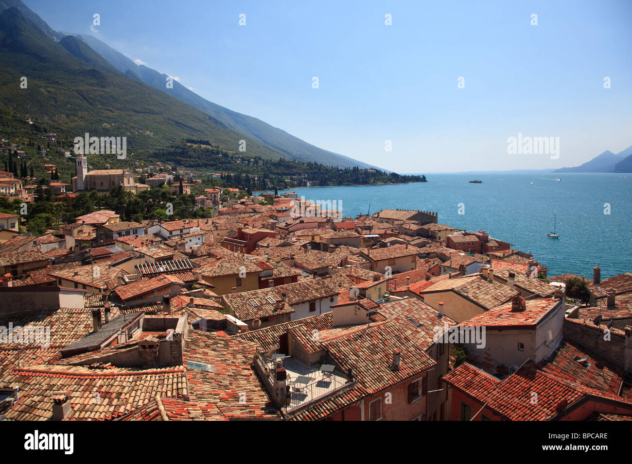 View over Lake Garda over the tiled roofs of Malcesine, Lake Garda, Italy Stock Photo