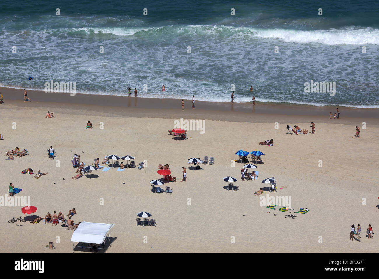 Sunbathers on Ipanema Beach, Rio de Janeiro, looking towards Arpoador