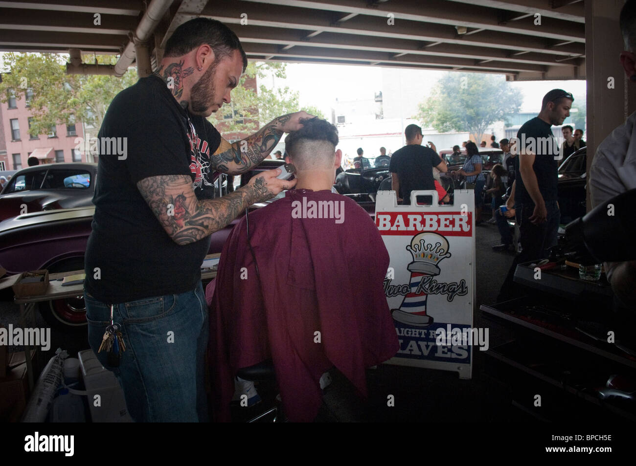 An al fresco barber shop at the "Kustom Kills and Hot Rod Thrills" car