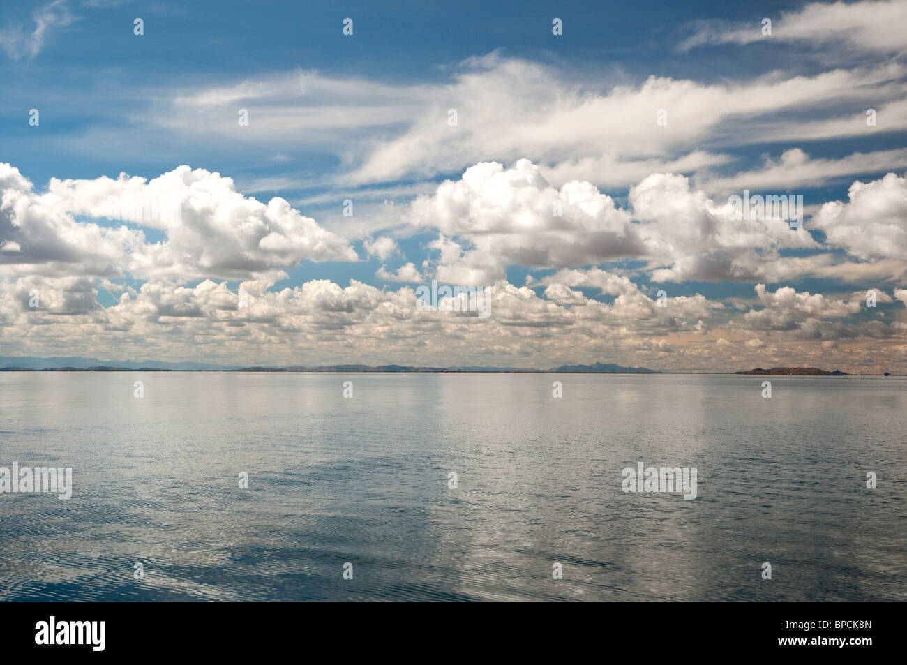 Lake Titicaca reflections of clouds in Peru. Stock Photo