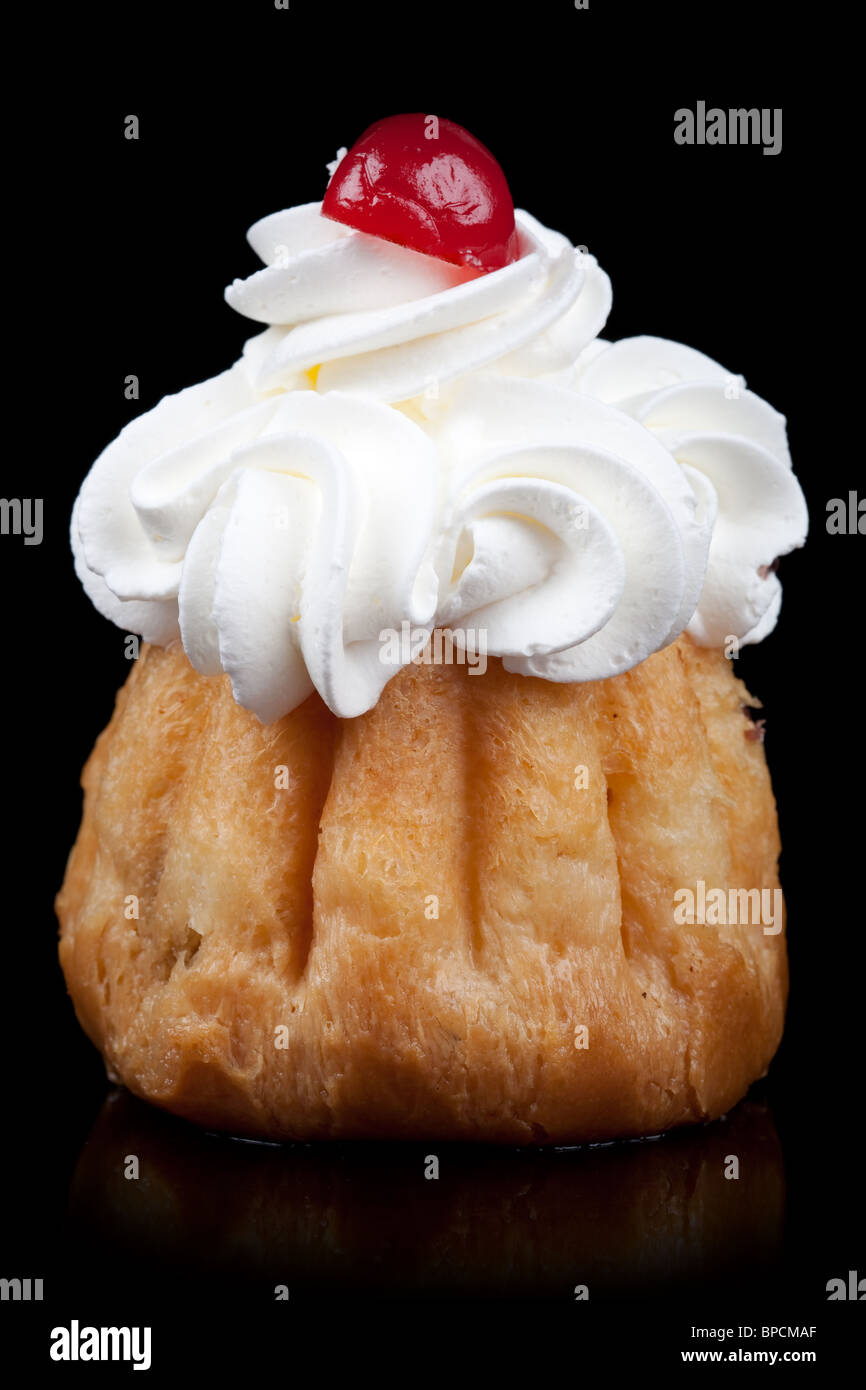 Appetizing Cake With Whipped Cream And Cherry Isolated On Black Stock ...