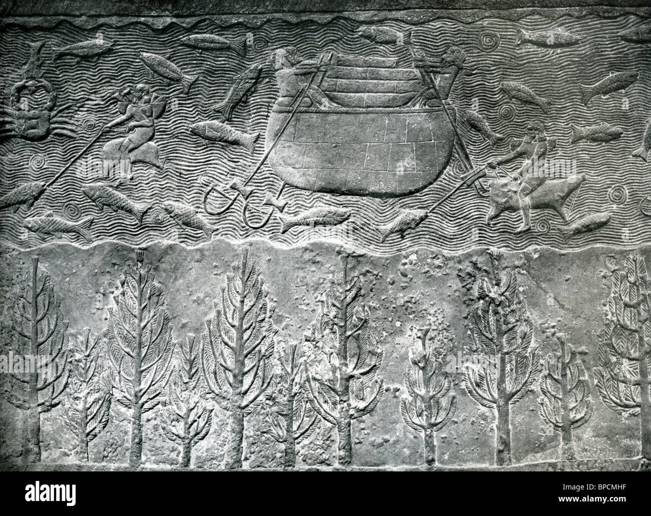 This relief, from the palace of Sennacherib at Nineveh, the capital of ancient Assyria, has a barrel-shaped boat with fishermen. Stock Photo
