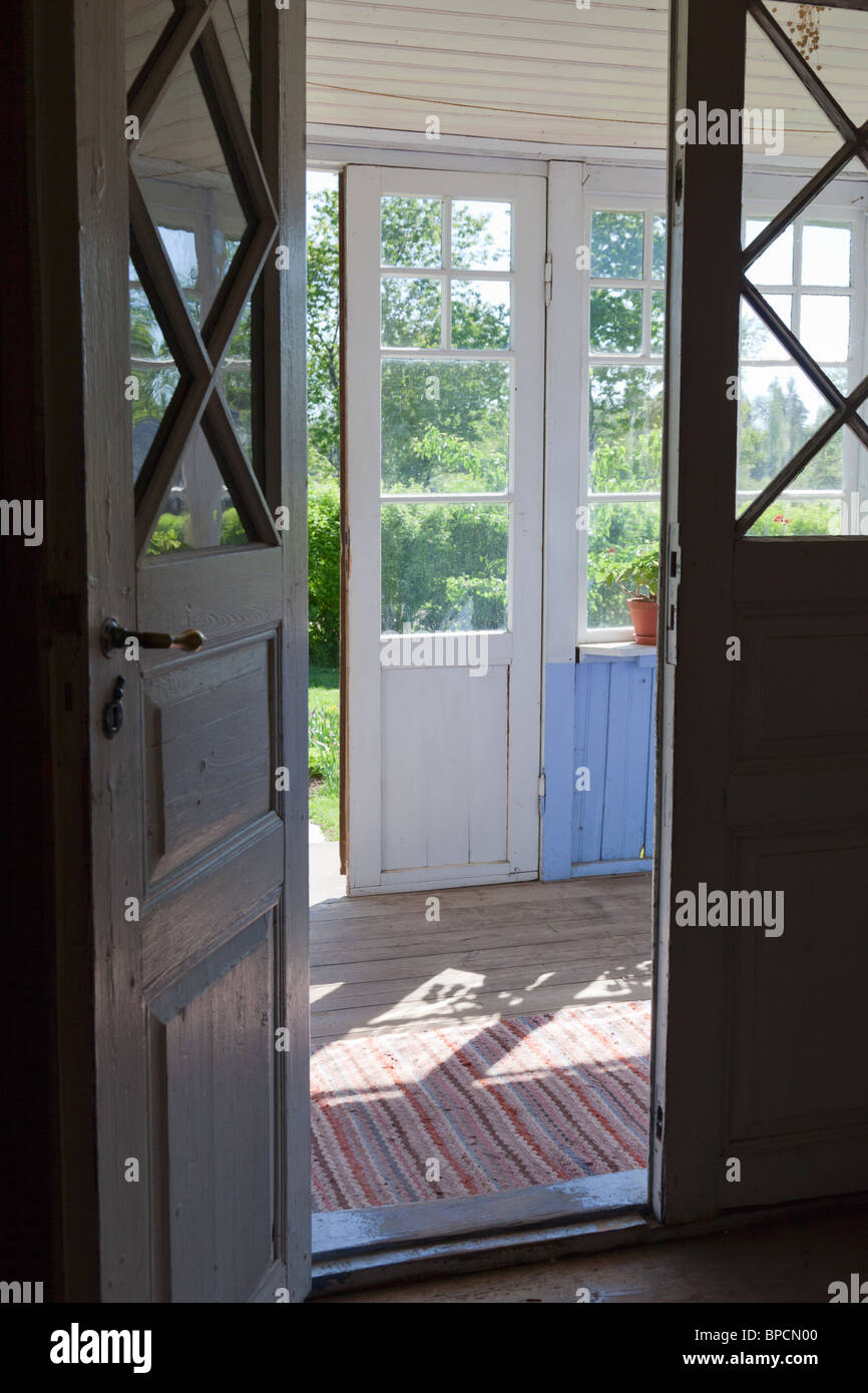 Front door to the porch of an old cottage Stock Photo